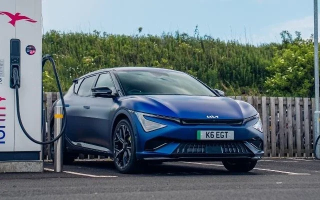 Kia EV6 charging at a rapid public charging station in Northern Ireland